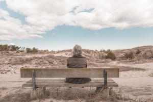 woman, older alone on bench