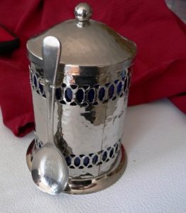 silver canister using cleaned spoon